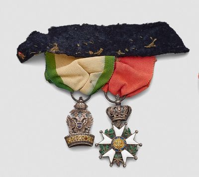 two medals and a medal on a white background