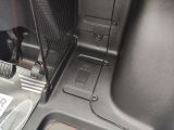 a close up of the inside of a car ' s trunk
