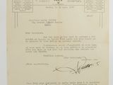 a close up of a document with a handwritten letter on it