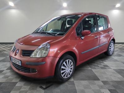 an image of a red car parked in a garage