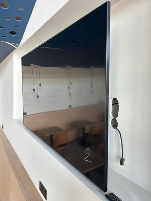 a flat screen tv mounted on a wall in a room