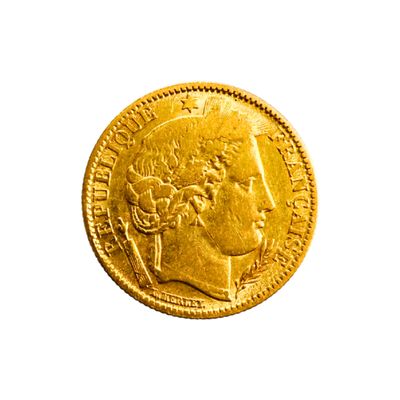 l'image d'une pièce d'or sur laquelle figure une tête de femme
