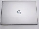 an open laptop computer sitting on top of a white table