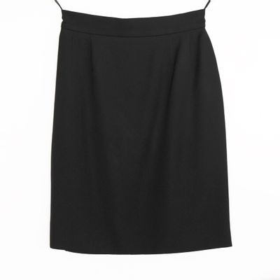 a black skirt on a hanger against a white background