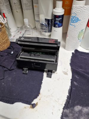 Distributeur de papier aluminium WELLA en PVC noir