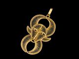 un pendentif plaqué or orné d'un motif en spirale sur fond noir