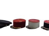 several hats are lined up in a row on a white surface