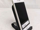 a cell phone that is sitting on a stand