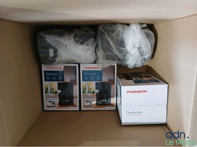two boxes that are sitting on a shelf in a box
