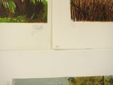 two paintings on the wall of a room one has a cat and the other has a dog