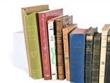 many books that are stacked on top of each other