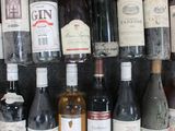 many bottles of wine that are on a shelf