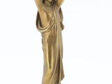 bronze statue of a woman holding a child on her shoulders