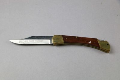 a knife that is laying on a table