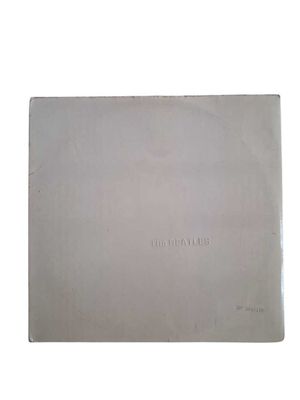 a close up of a book with a white cover on a white background