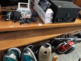a wooden table with a bunch of electronics on it