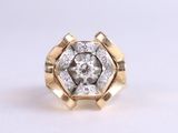 a close up of a diamond ring on a white surface