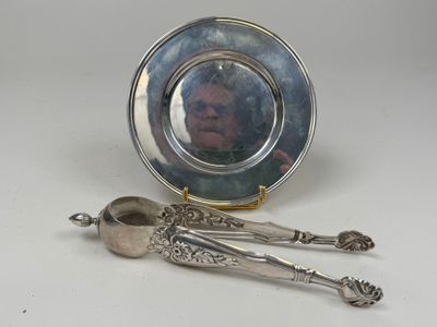 a picture of a silver plate with spoons and a picture of a man in a mirror