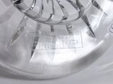 a glass vase with a bunch of scissors inside of it
