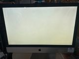 an apple computer monitor sitting on top of a desk next to a keyboard