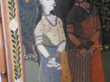a painting of two women standing next to each other