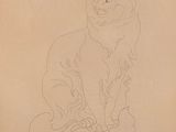 drawing of a cat sitting on top of a pillow on a table