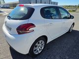 a picture of a white car parked in a parking lot