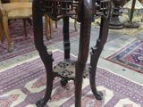 a small table with a wooden top in a room