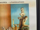 a poster with a picture of a woman sitting on a chair
