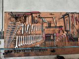 many tools hanging on the wall in the garage