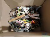 a cardboard box filled with assorted assorted items