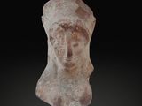 an image of a statue of a woman ' s head on a black background