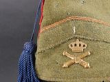 a green hat with a skull and crossbones on it