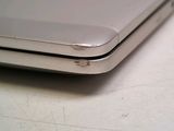 a close up of a silver laptop computer on a table