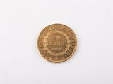 an image of a gold coin on a white surface
