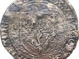 une pièce d'argent sur laquelle figure l'image d'un homme