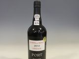 a bottle of wine that is sitting on a table