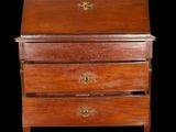 an antique wooden chest of drawers with brass hardware on the drawers