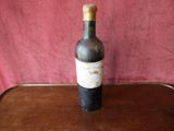 a bottle of wine that is sitting on a table