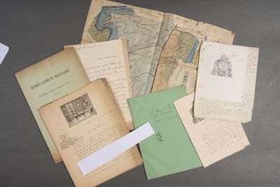 a pile of old papers on a table with a piece of paper sticking out of it