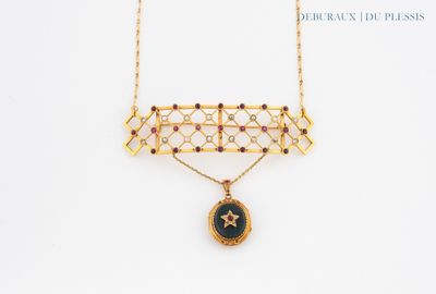 a close up of a necklace with a star on it