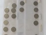 a lot of coins in a plastic bag on the table
