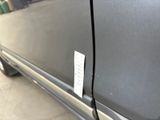 a close up of a car door handle with a tag attached to it