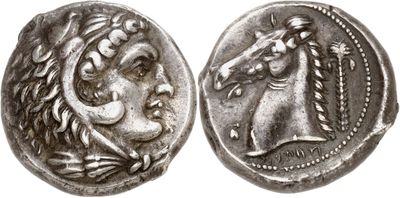 a silver coin with an image of a horse on it