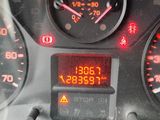 a close up of the dashboard of a car with the time displayed