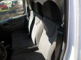 the interior of a car with the door open and the seats down