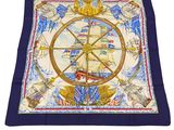 a close up of a square scarf with a ship wheel on it