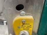 a close up of a machine with a wren on it