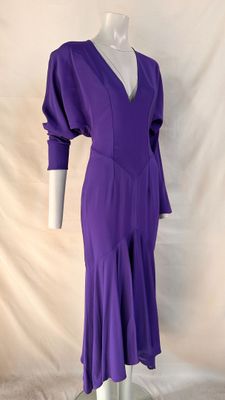 purple dress on a mannequin display on a white background