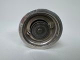 a metal object that is sitting on a white surface